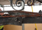Rust jacking and decay where the original overthrow is fixed to the modern support beam