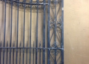 Hot forged bow-topped double gates by Ironart of Bath