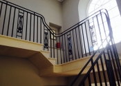 Wrought iron staircase with cast iron panels
