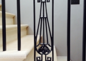 Wrought iron staircase with cast iron panels