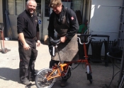 Jason Balchin and Luke Hannaford figure out the assembly of Ironart's brand new Brompton Bike