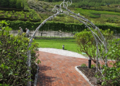 The large Malvern flower arch, by Ironart of Bath - installed at the Eden Project, Cornwall