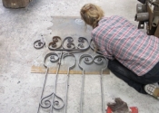 Cecilie Robinson at work on the refurbishment of the chapel gates of St Mary Tory, Bradford on Avon