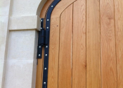 Westsood Bothy curved wrought iron hinges by Ironart of Bath
