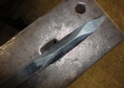 Heating and tapering bars to form leaves