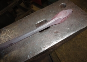Heating and tapering bars to form leaves