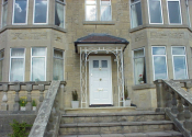 Gloucester Road. White painted wrought iron porch