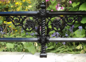 Cast iron double rail, mounted on a low stone wall in Evelyn Street, Bath