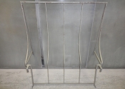 Stripped wrought iron door canopy frame.