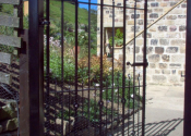 Single gate with flower finials at Ramsgill, North Yorkshire