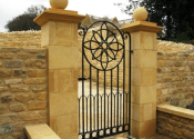 Wrought iron garden gate with flower detail, Ebrington