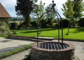 Chiddon Well head and wrought iron overthrow